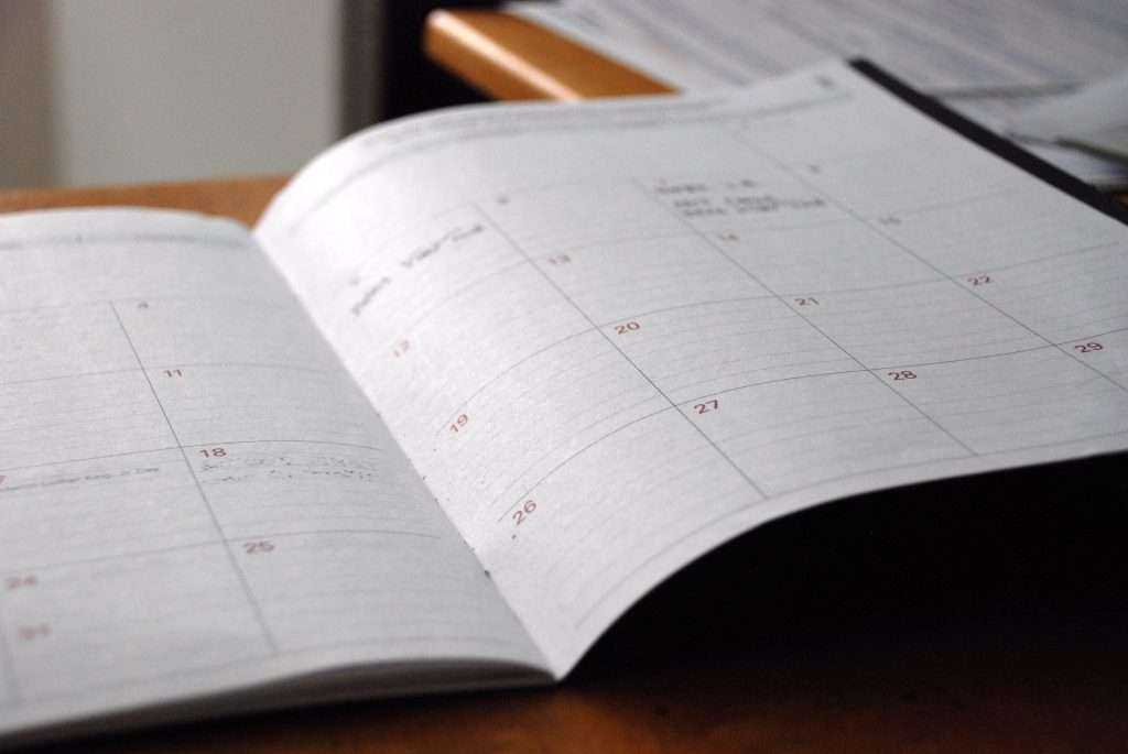 Open date planner on desk Open date planner on desk